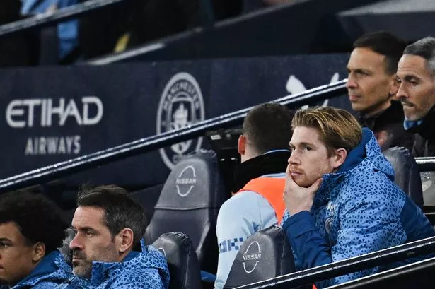 Manchester City's Belgian midfielder #17 Kevin De Bruyne sits in the stands during the English Premier League football match between Manchester City and Brentford at the Etihad Stadium in Manchester, north west England, on February 20, 2024. (Photo by Paul ELLIS / AFP) / RESTRICTED TO EDITORIAL USE. No use with unauthorized audio, video, data, fixture lists, club/league logos or 'live' services. Online in-match use limited to 120 images. An additional 40 images may be used in extra time. No video emulation. Social media in-match use limited to 120 images. An additional 40 images may be used in extra time. No use in betting publications, games or single club/league/player publications. / (Photo by PAUL ELLIS/AFP via Getty Images)