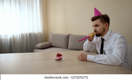 depressed-young-male-party-hat-260nw-1271076772.jpg