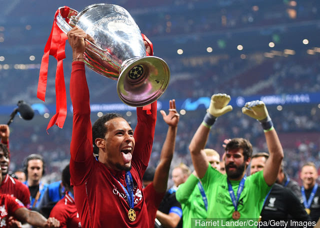 virgil_van_dijk_and_alisson_becker_of_liverpool_celebrate_with_t_1234654.jpg